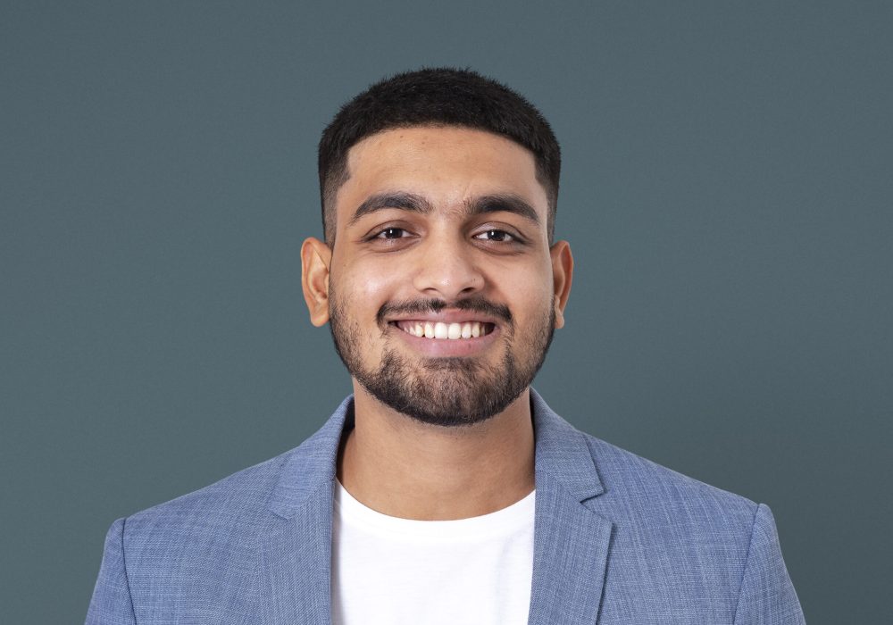 Cheerful Indian businessman smiling closeup portrait for jobs and career campaign